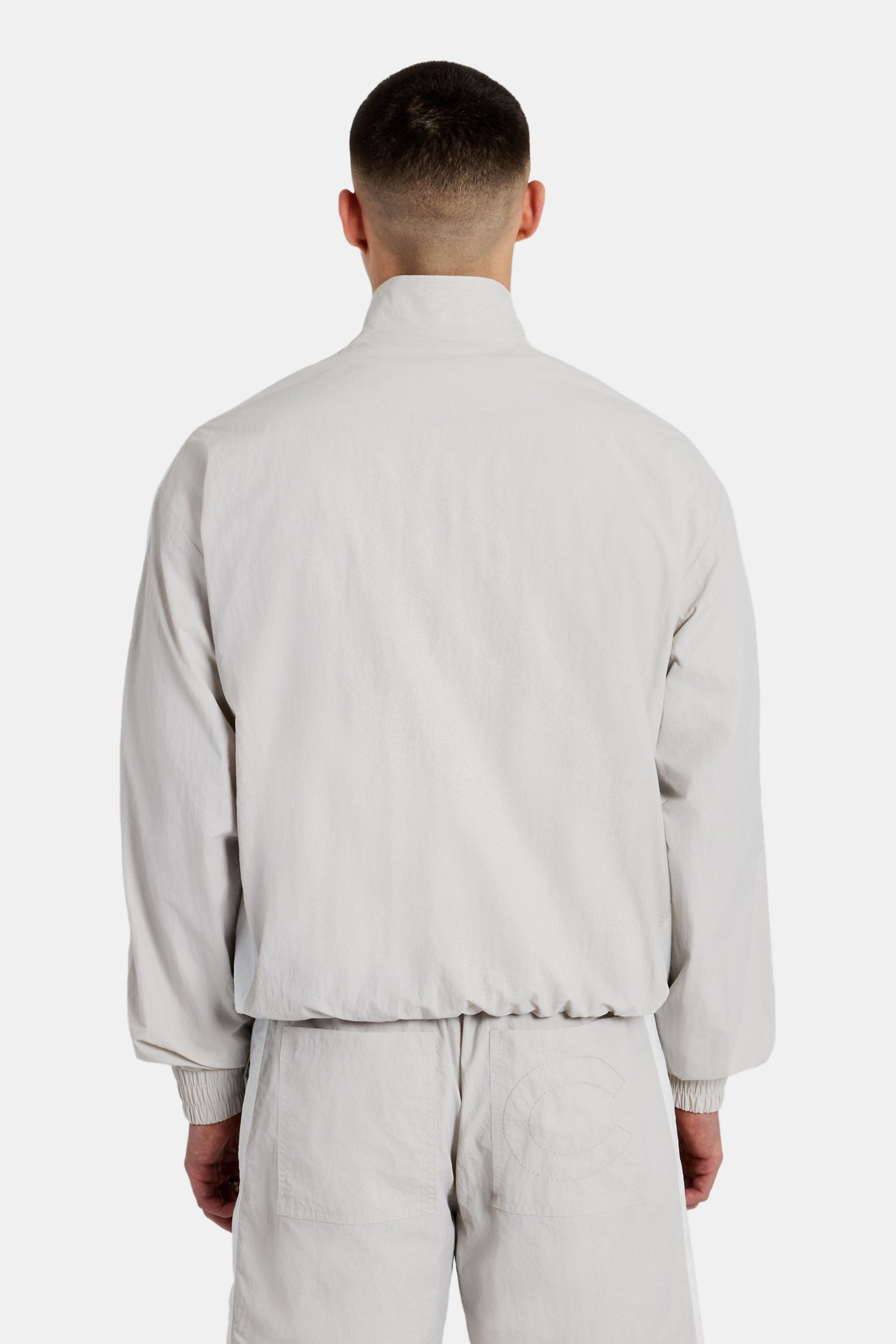 Cernucci Set aus Trainingsjacke und Shorts aus Nylon mit Einsätzen - Stein